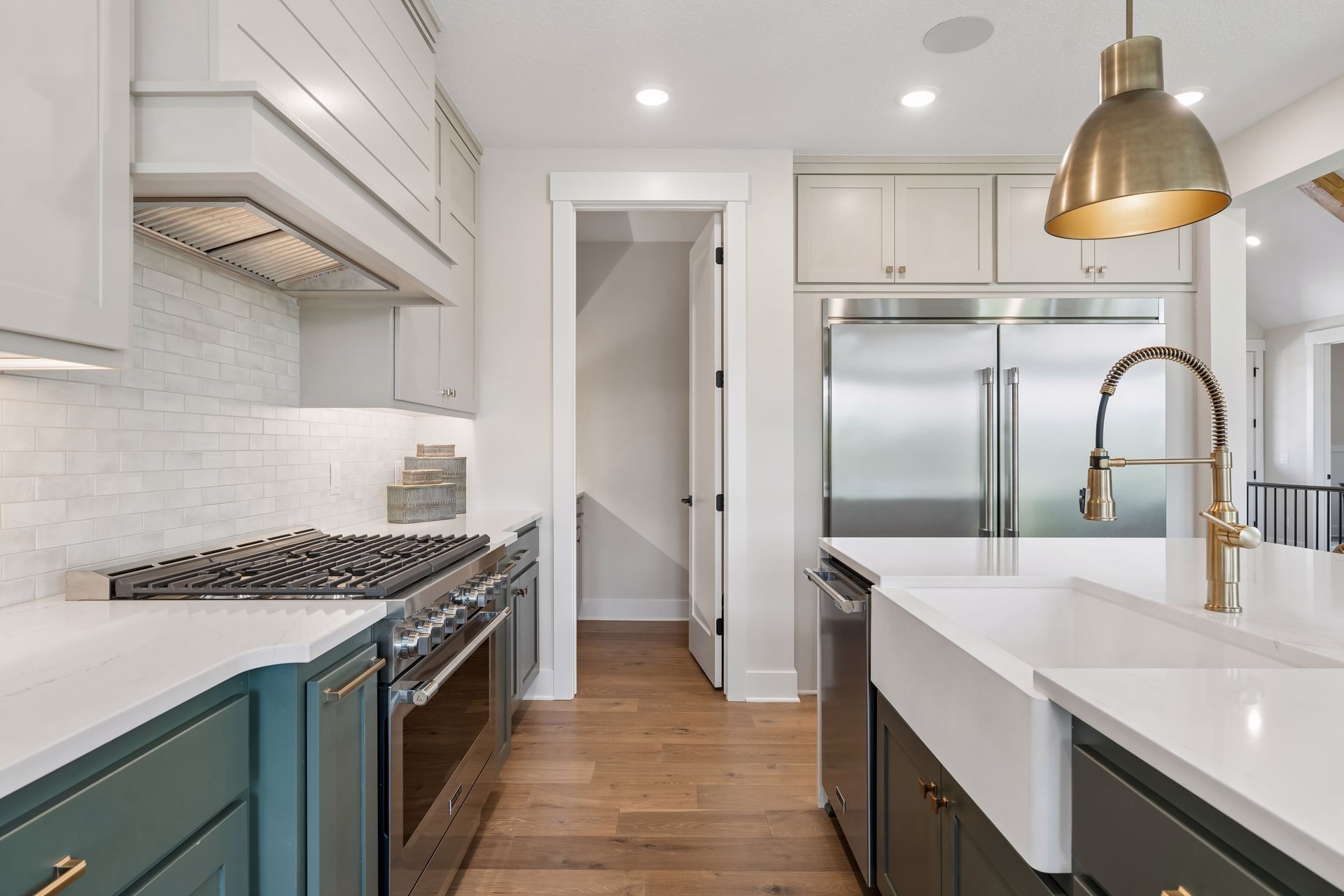 Gourmet kitchen with farmhouse sink custom range and walk-in pantry